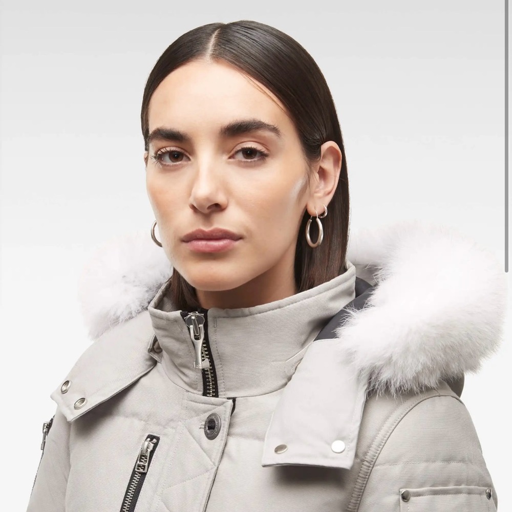 Moose Knuckles Gray Puffer Jacket with Fur Trim and High Collar.
